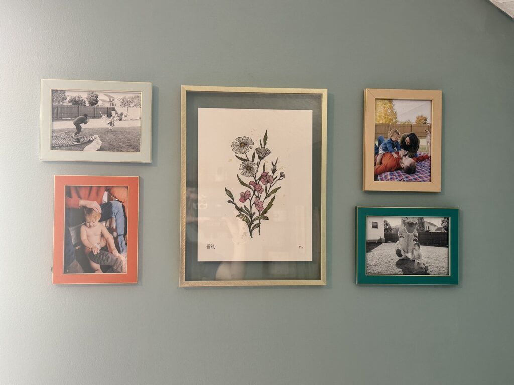 A collage of family photo frames on a wall