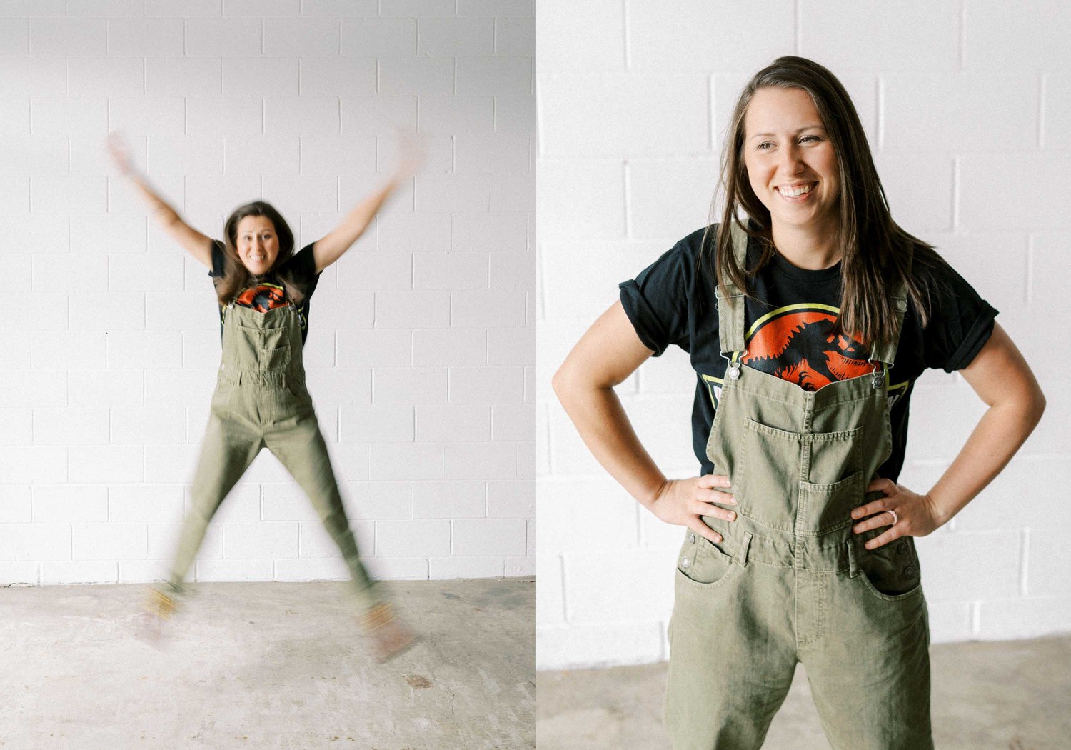 A lady in green overalls does a jumping jack in front of a white brick wall