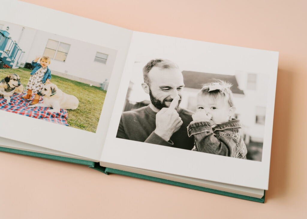 A photo album with pictures of a young toddler
