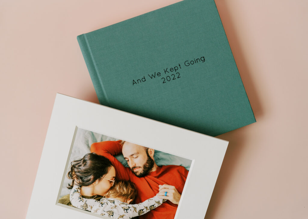 A photo album with a blue cover that says "and we kept going 2022"