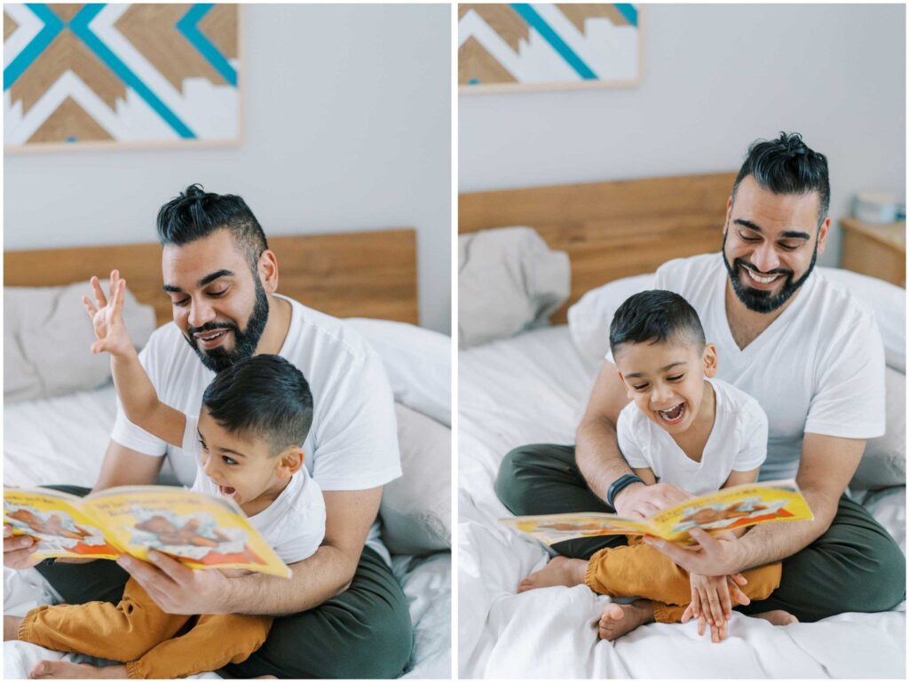 A dad reads a book enthusiastically to his young son
