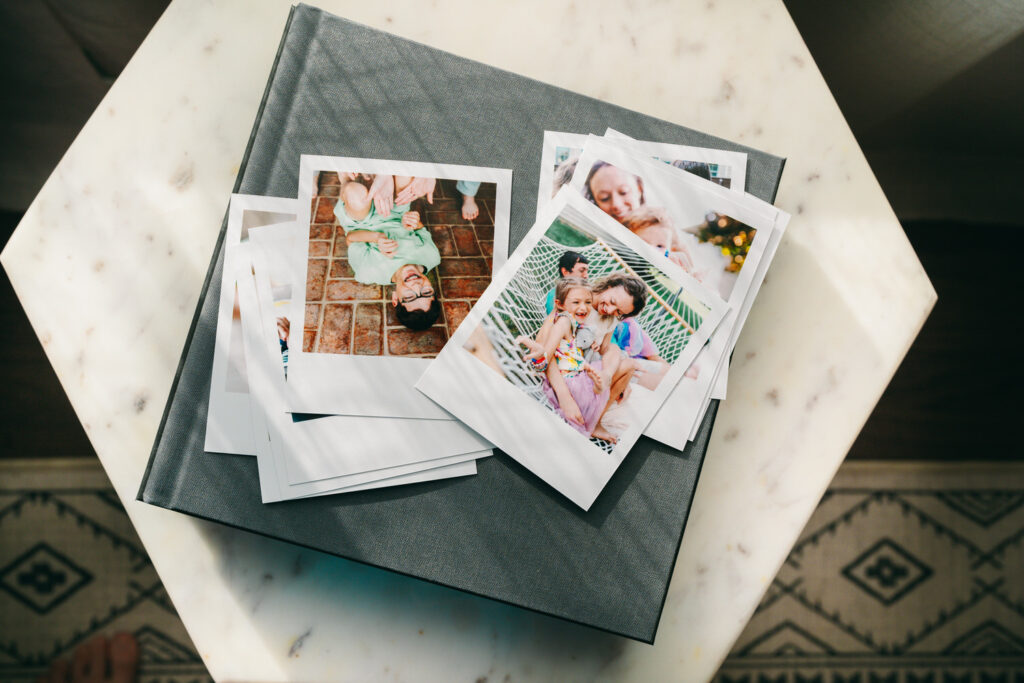 a scattering of retro style polaroid prints on a coffee table