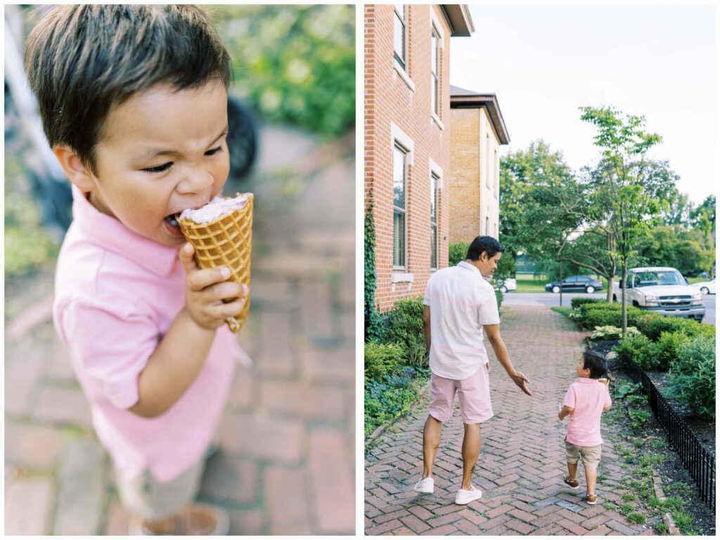 little boy eats a waffle ice cream cone while walking down the sidewalk with his dad