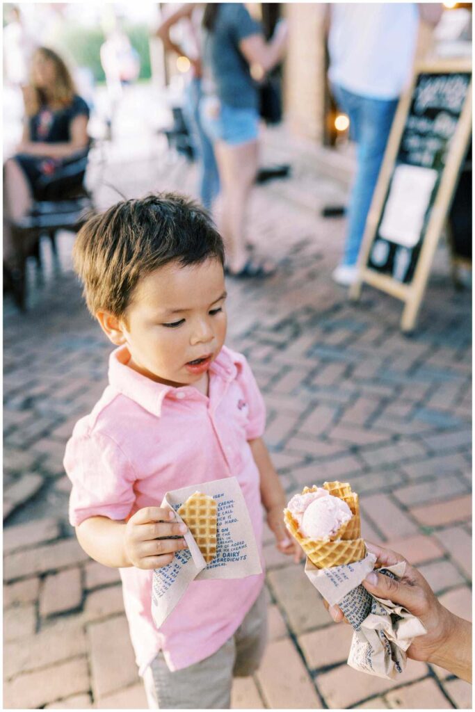 Little boy looks at a waffle ice cream cone