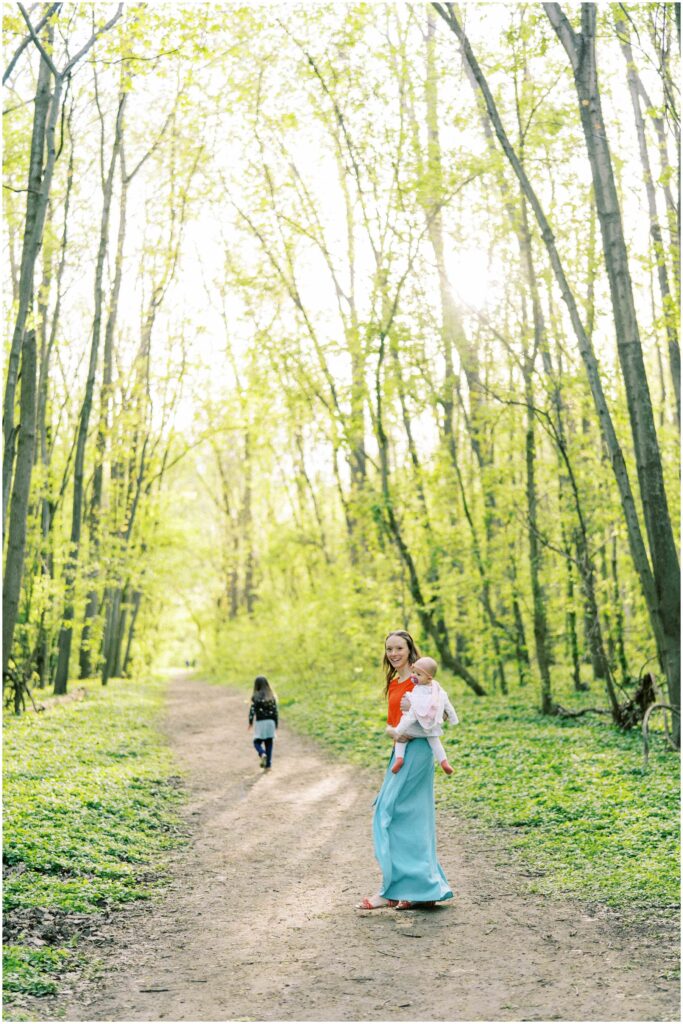 A family walking in the forest at Scioto Grove Metropark in Ohio