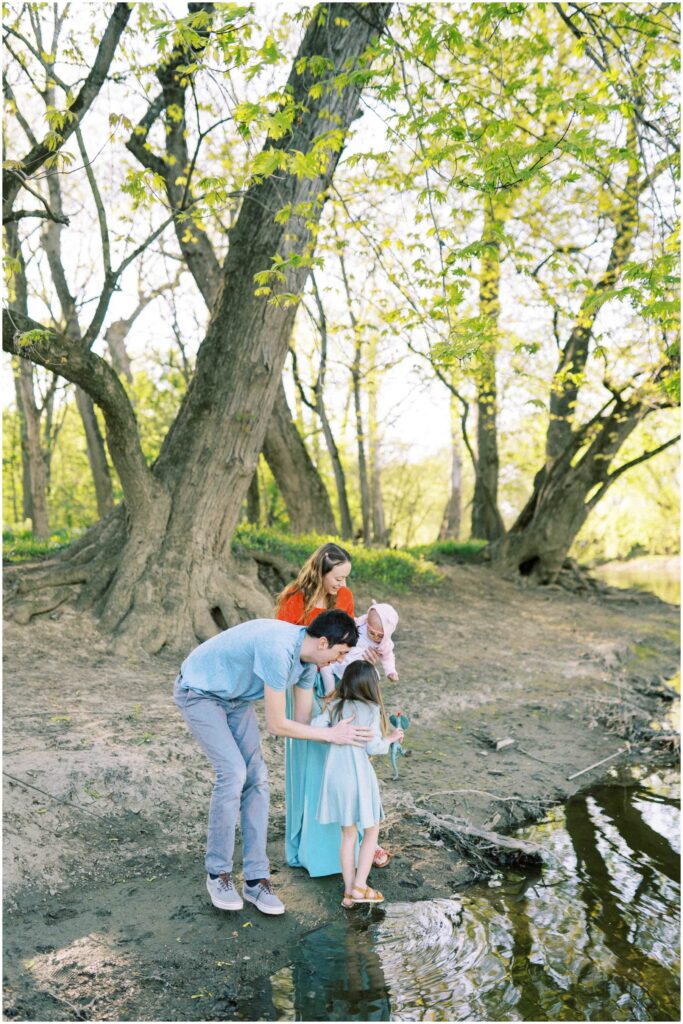 A family walking along a riverbed at Scioto Grove Metropark in Ohio